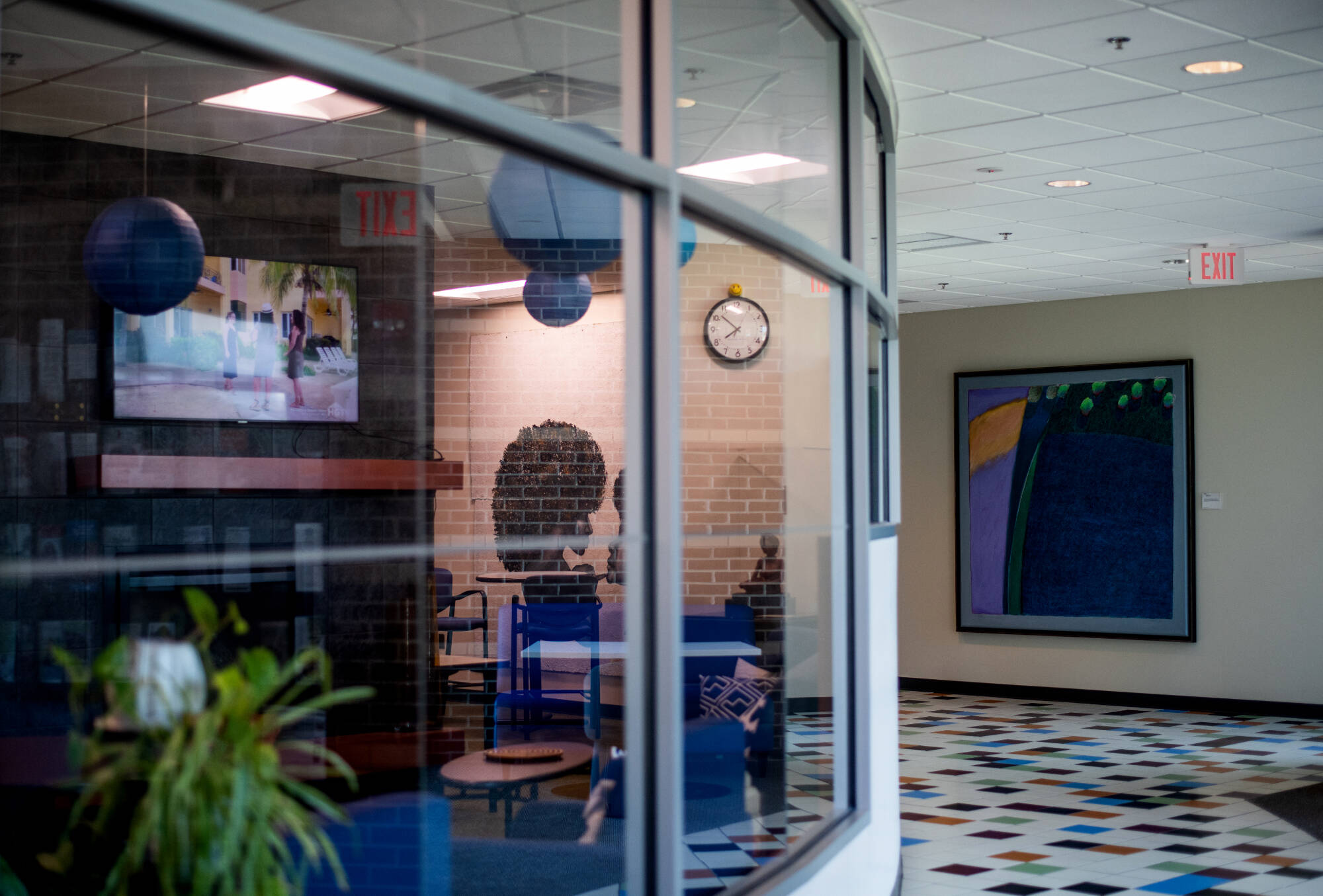 The exterior of the CWGE's curved glass windows